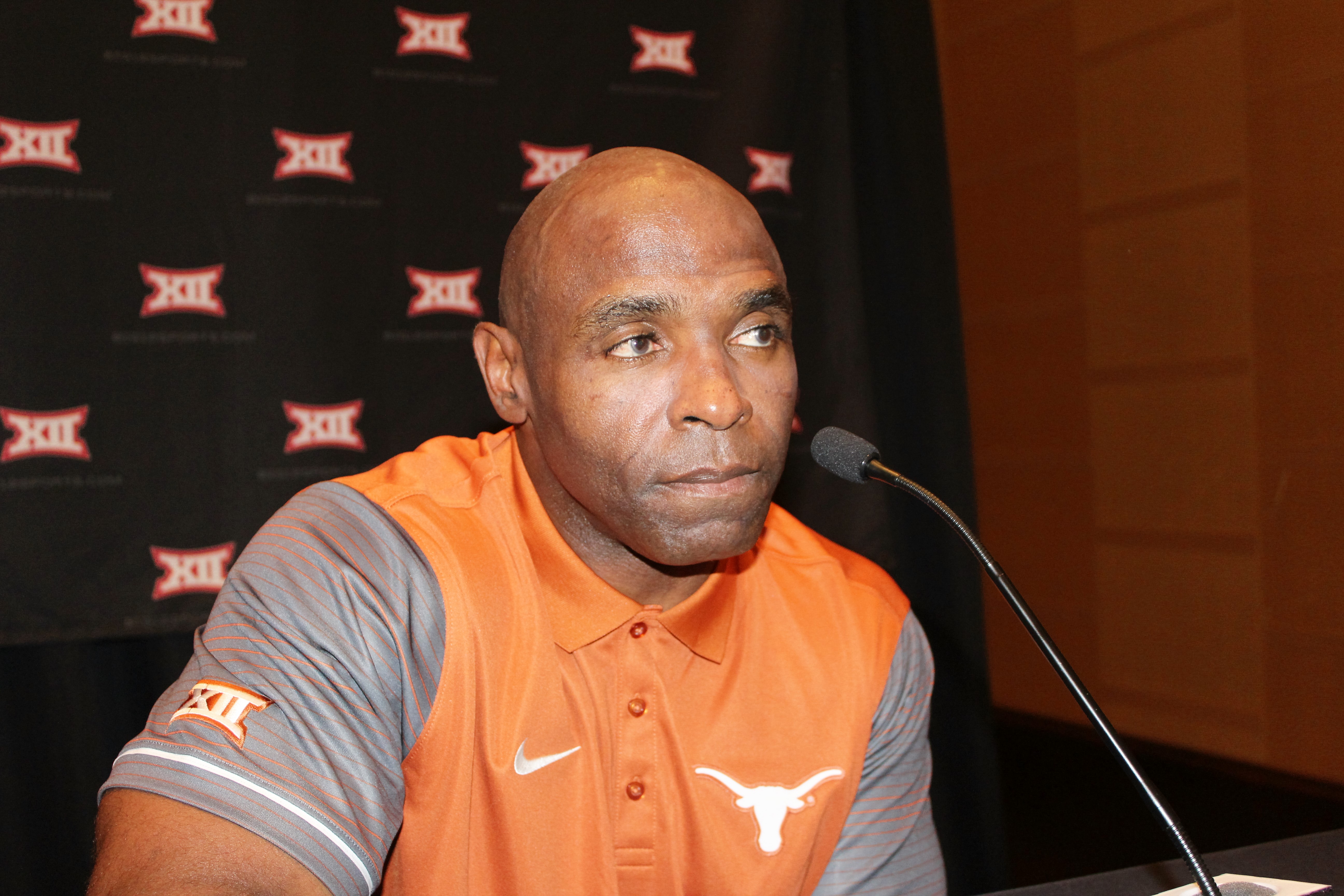 Charlie Strong sitting